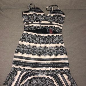 Slim fit black and cream colored dress